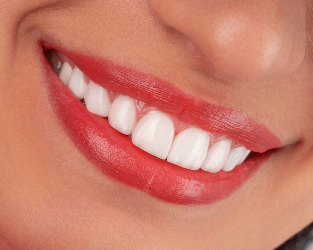 close up of a womans smiling mouth with red lipstick kzmhijj041m.jpeg